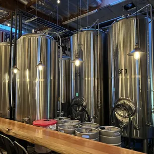 a row of stainless steel tanks