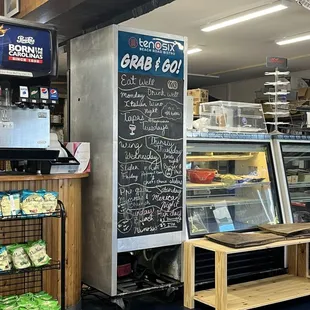 a bakery with a chalkboard menu