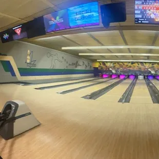 Panoramic view of the lanes and overhead automatic electronic scoreboards.