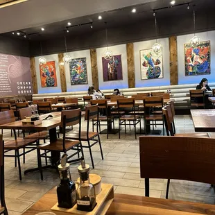 a restaurant with tables and chairs