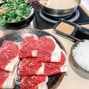 a variety of raw meat on a plate