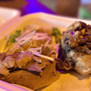a close up of a meal in a styrofoam container