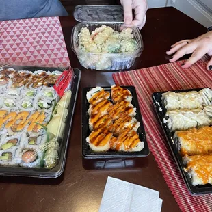  a group of people eating sushi