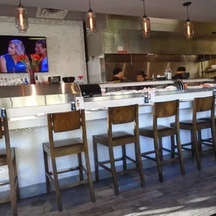 View of the sushi bar from my table.