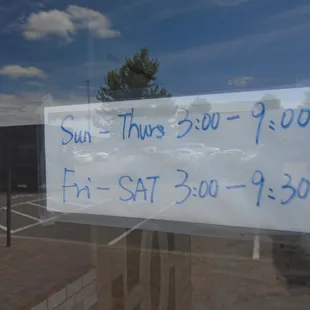 Hours of operation, front entry door.