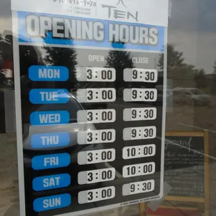Hours of operation, front entry door.