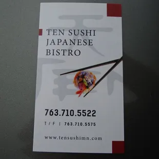 Business card with contact info.