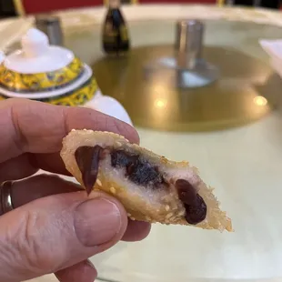 Sesame ball with sweet red bean paste, lots of paste.   Yummy.