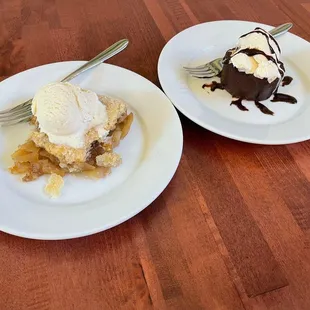 two plates of dessert on a wooden table