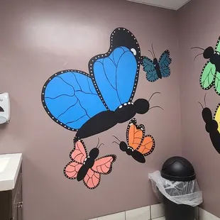 a bathroom decorated with butterflies