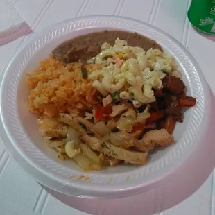 The food was awesome. It's a beef and chicken with rice, rice beans and macaroni salad plate.