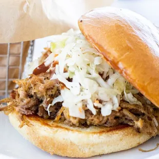a pulled pork sandwich with coleslaw