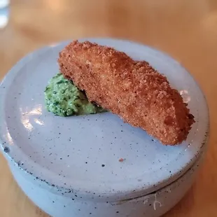 a piece of fish on a plate