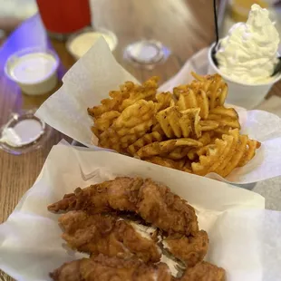 Custard, waffle fries and crispy tenders. Sauces buttermilk dill and whipped blue cheese.