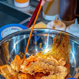 a person mixing food in a bowl