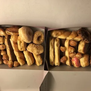 two boxes filled with donuts
