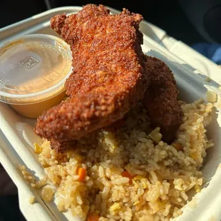 fried chicken and rice in a styrofoam container