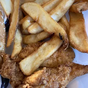 a plate of fried chicken and french fries