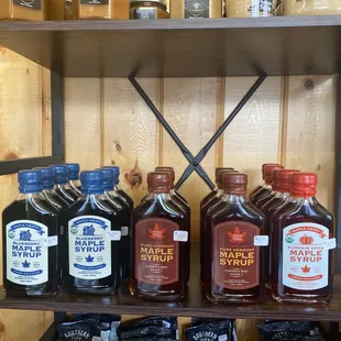 a shelf full of liquor bottles