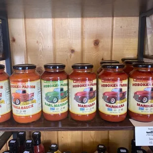 a shelf of jars of hot sauce