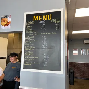 a menu on a chalkboard in a restaurant