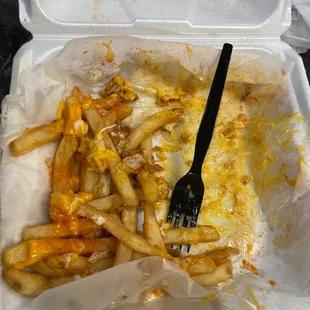 a plastic container with a fork in it