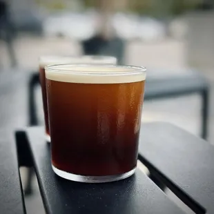 two glasses of coffee on a table