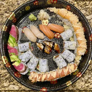 Maki:  Amazing Tuna Roll, Hawaii Roll, Firecracker Roll, Spicy Tuna Roll.  Nigiri:  Alaska Roll, Eel, Escolar, Salmon
