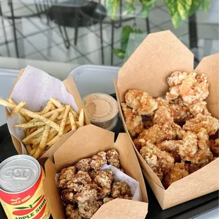 a tray of fried chicken and french fries