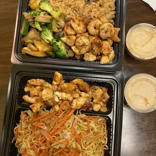 two trays of food on a table