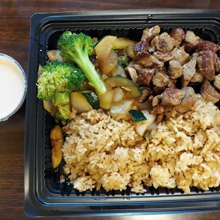 a meal of rice, broccoli, and meat