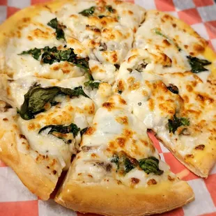 The Popeye Spinach, feta, mushroom, and Alfredo sauce.