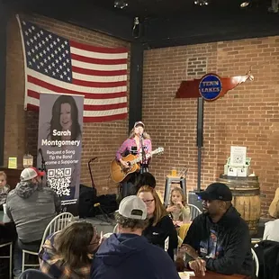 a woman playing a guitar