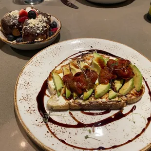 Avocado toast and biscuits with chocolate gravy.