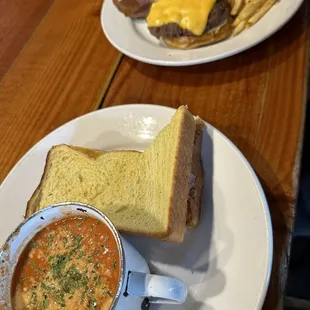 Grilled cheese and tomato soup and cheese burger with French fries