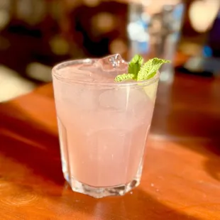 a pink drink with mint