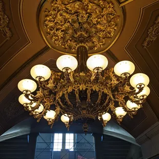Ceiling and chandelier. The second floor is under construction.