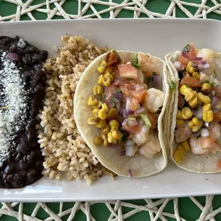 Shrimp tacos with rice &amp; beans - the roasted corn and side sauce added great texture and flavor