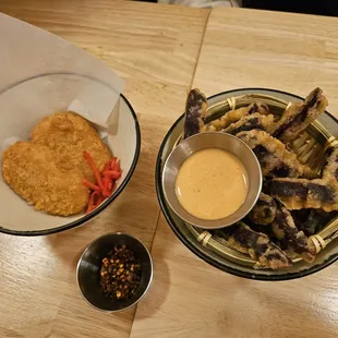 a bowl of fries and a bowl of dipping sauce