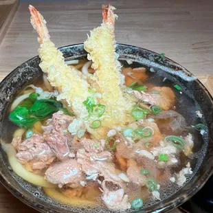 a bowl of food on a wooden table