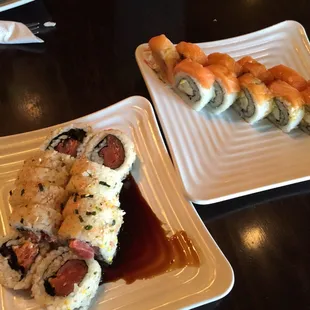 two plates of sushi on a table