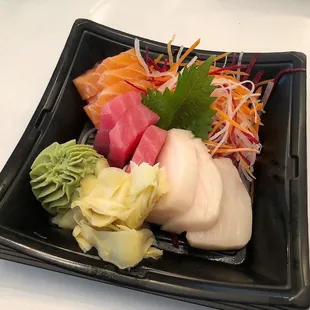 a plate of sushi and vegetables