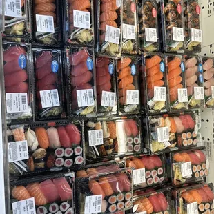 a display of sushi and rolls