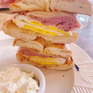 Happy bagel stack Sunday   Ernie Bagel: black forest ham, swiss cheese &amp; 2 fried eggs with cream cheese on the Side Deli Salad