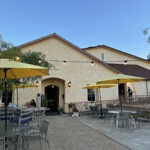 patio area with tables and umbrellas