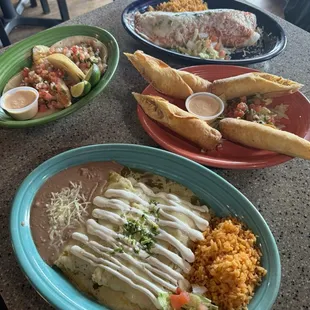 D - Enchiladas Rojas , tacos, and burrito