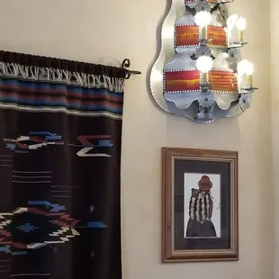 The tinwork is amazing! Besides the sconces on the walls, there is a wondrous chandelier.