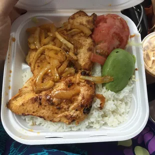 chicken, rice, and vegetables in a styrofoam container