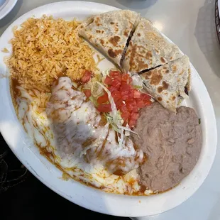 Beef Quesadilla, Chicken Enchilada, Rice and Beans. I loved everything besides the enchilada because the shredded chicken was tough.