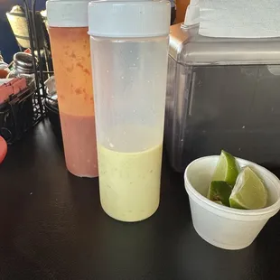 two condiments and a bowl of salsa